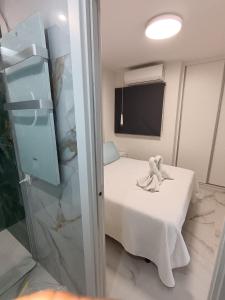 a room with a room with a bed and a tv at Marco Apartment By Torremolinos On-line in Torremolinos