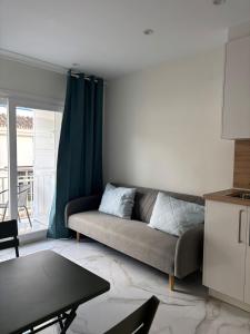 a living room with a couch and a table at Marco Apartment By Torremolinos On-line in Torremolinos