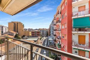 a view of a city street from a balcony at Large apartment with terrace AC e WiFi in Sesto San Giovanni