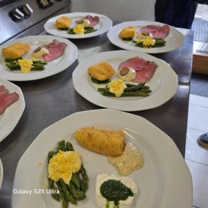 a group of plates of food on a table at Rifugio Combe D'Imbert Vittoria in Champ Quartier