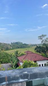 a view of a house with a red roof at Ayathma Heights in Weligama