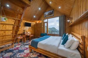a bedroom with a bed in a room with wooden walls at Gadegal Homestay Narkanda - Rooms & Pahadi Café in Shimla +12 photos