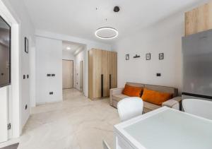 a living room with a couch and a table at Relax Seafront Apartment by PS in Golem