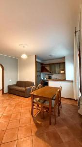 a kitchen with a table and chairs and a couch at La Busa alloggi e trattoria in Ponte San Nicolo +60 photos