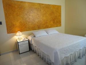 Voodi või voodid majutusasutuse HOTEL MAISON FIORI (Centro) toas