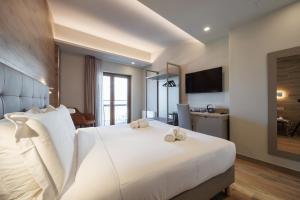 a hotel room with a bed with towels on it at Lift Hotel in Sauze dʼOulx +51 photos