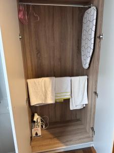 a towel rack in a bathroom with white towels at Home sweet home in Drogheda