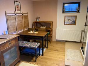 a room with a table and a table and chairs at Baers Mountain Stay Außerbraz in Innerbraz
