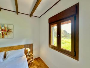 a bedroom with a bed and a window at Villa El Guanche -Boutique Apartments & rooms in Gáldar +97 photos