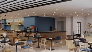 a rendering of a restaurant with tables and chairs at Spark By Hilton Van City Centre in Van