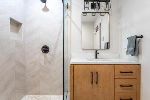 a bathroom with a shower and a sink at Lakefront with Private Dock & Canoe Kenoza Den in Jeffersonville +41 photos