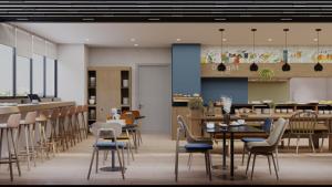 a rendering of a restaurant with tables and chairs at Spark By Hilton Van City Centre in Van