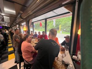 a group of people sitting at a table in a restaurant at Dragon City in Maryville +44 photos