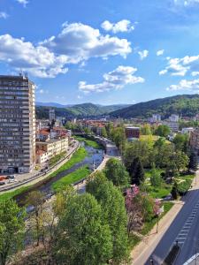 a view of a city with a river and buildings at The View -Balkan Tower безплатно паркомясто in Gabrovo
