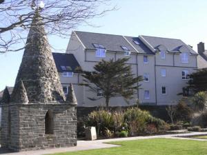 a large building with a stone tower in front of it at Kirkwall town centre apartment 1 in Kirkwall