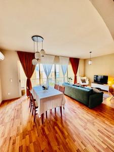 a living room with a table and a couch at Sea View apartment in Sliema in Sliema