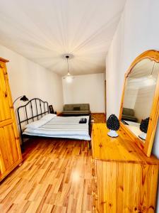 a bedroom with a bed and a mirror at Sea View apartment in Sliema in Sliema