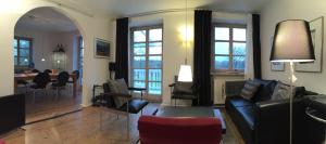 a living room with a couch and a dining room at Pure Nature Munich - Amper Meadows/Freising in Haag an der Amper