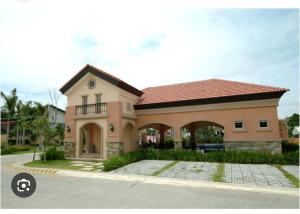 a large house with a roof at Modern 2 Storey 2BR Home with 2 Parking Space in Manila