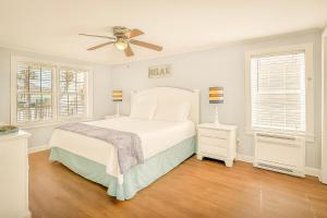 a bedroom with a bed and a ceiling fan at Crescent Beach 3 Bedroom with Pool, Across the Street from Ocean in Myrtle Beach +13 photos