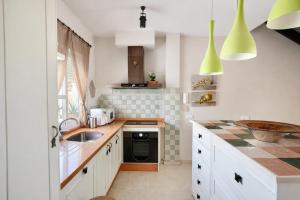 a kitchen with a sink and a counter at Sonia Home in Córdoba