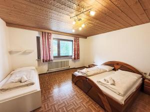 a room with two beds and a window at Chalet Schlitters by Interhome in Schlitters