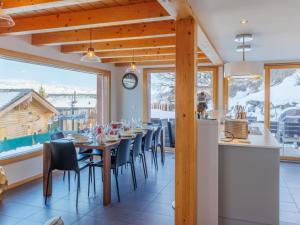 a dining room with a long table and chairs at Chalet La Balance by Interhome in Nendaz