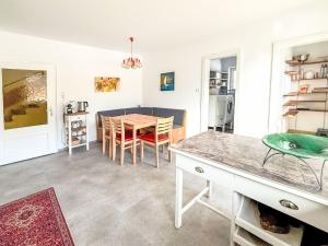 a kitchen and dining room with a table and chairs at Villa Acereto by Interhome in Nassereith