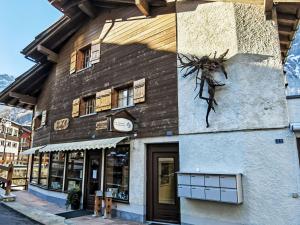 a building with a spider on the side of it at Apartment Studio Turmalin by Interhome in Leukerbad