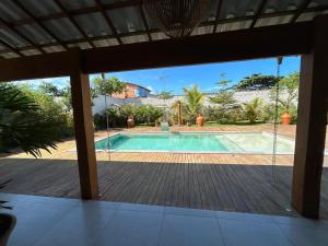 a view of a swimming pool from the porch of a house at Casa Prado in Prado