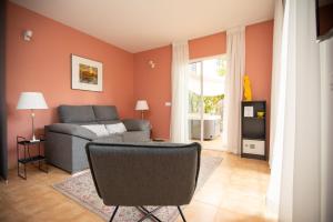 a living room with a couch and a table at Villa Nestor in Ingenio