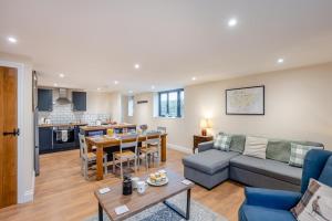a living room with a couch and a table at 2 Bed in Feering oc-p29293 in Feering