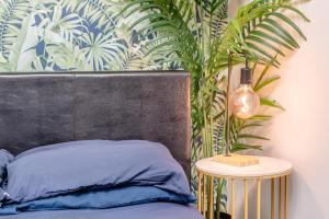 a bedroom with a bed and a plant at 4 Bed in Brecon oc-h30823 in Brecon