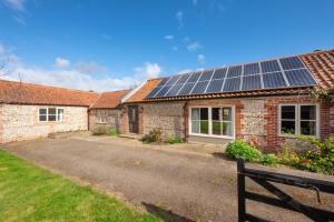 a house with solar panels on the roof at 3 Bed in Ridlington oc-2253 in Walcott