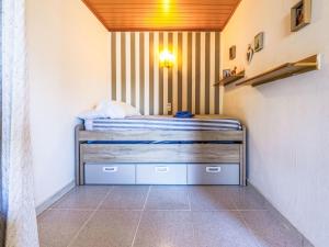 a small bedroom with a bed in a room at Apartment Delfines by Interhome in Cambrils +20 photos