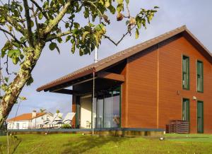 a house with a large glass facade at Vencello Estelar Compostela in Santiago de Compostela