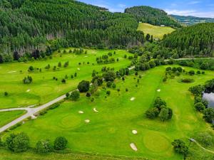 an overhead view of a golf course with a green field at Apartment Old Stable on Aigas Golf Course by Interhome in Beauly