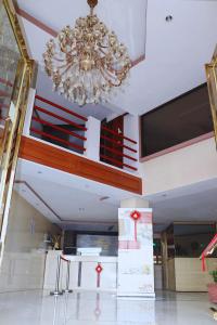 a chandelier hanging from the ceiling in a building at Hotel La Esperanza in Chitré