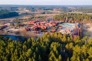 an aerial view of a resort in the woods at Zajazd Fojutowo in Legbąd