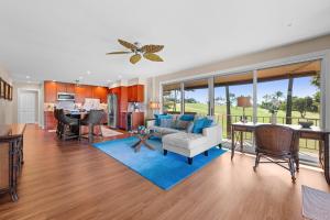 a living room with a couch and a table at Maui Eldorado H202 in Kaanapali +49 photos