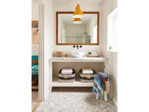 a bathroom with a sink and a mirror at Cambria Beach Lodge in Cambria +24 photos