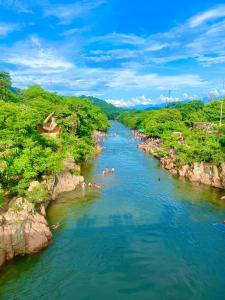 a group of people swimming in a river at Apartaestudios Galanni in Valledupar