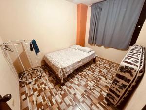 a hospital room with a bed and a window at Apt 1 in Tena
