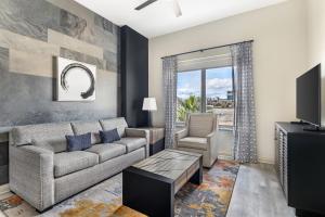 a living room with a couch and a tv at Bluegreen Vacations Club 36, an Ascend Collection Resort in Las Vegas