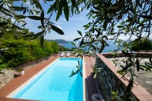 a swimming pool with a view of the water at Villa Ciacia in Cervo