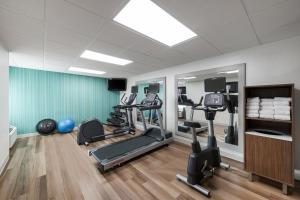 a gym with several exercise equipment in a room at Holiday Inn Express San Diego - Sea World Area by IHG in San Diego