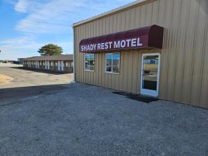 a building with a sign that reads show first motel at Shady Rest Motel in Arapahoe