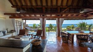 a living room with a view of the ocean at Stunning, Oceanfront Casa de Olas in Ixtapa-Zihuatanejo International