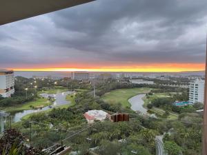 a view of a city with a river and buildings at luxury 2bed condo in Nuevo Vallarta