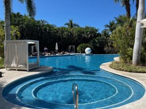 a swimming pool with a swimming poolvisorvisor at luxury 2bed condo in Nuevo Vallarta
